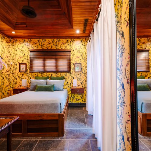 Spacious bedroom with king size bed and stylish tropical design at a Playa Langosta vacation rental in Tamarindo, Costa Rica. Peaceful atmosphere and comfortable interiors perfect for family vacations and coastal getaway stays.