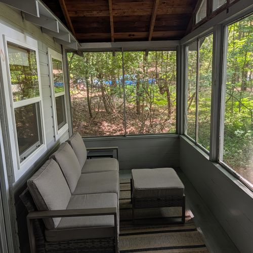 FRONT PORCH: The comfy, furnished screened-in front porch. Great for unwinding after a long day!