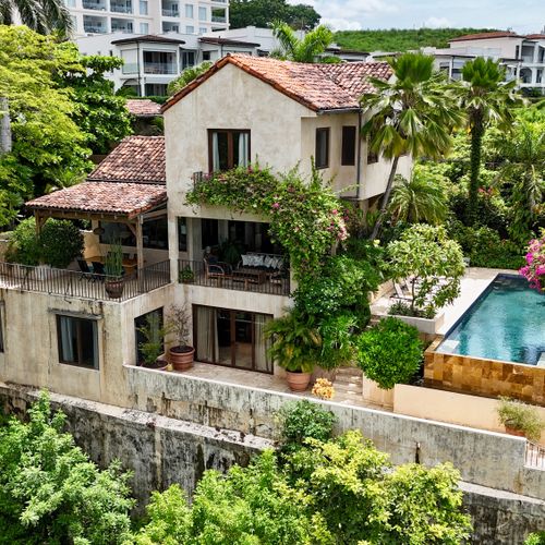 Aerial view of the home and pool