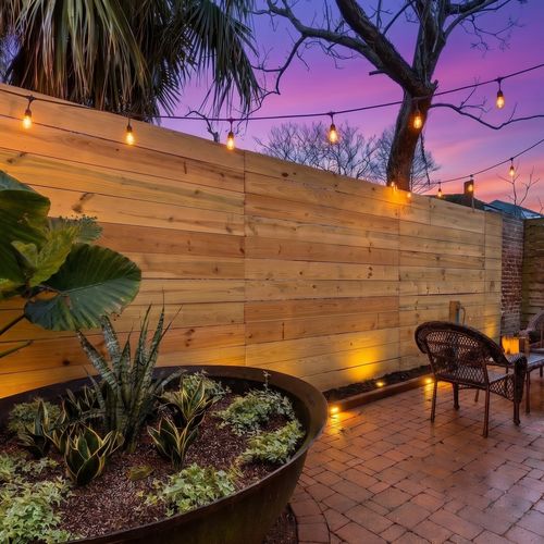 Sunny, fenced backyard patio — your own tucked-away outdoor retreat.