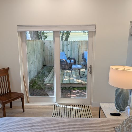 LIVING SPACE: View from the comfy full-size out into the beautiful fenced-in backyard
