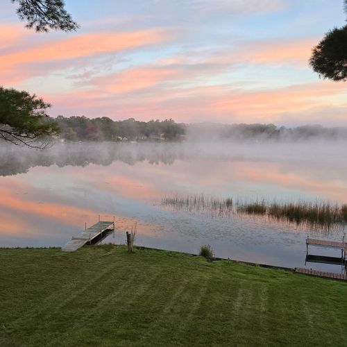 OVERVIEW:  The beautiful backyard and private lakefront with private dock.