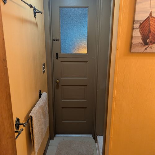 BATHROOM #1 (MAIN FLOOR):  Full bathroom on the main floor with a walk-in shower.