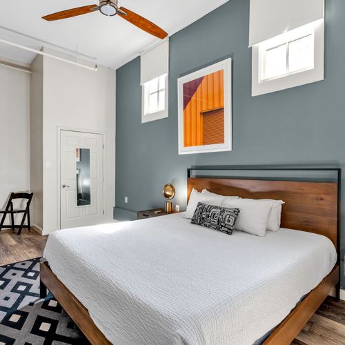Industrial-chic bedroom with a statement print