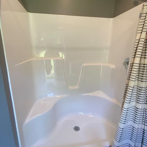 BATHROOM #2:  Full bathroom with a walk-in shower, toilet, sink, vanity, and mirror.
