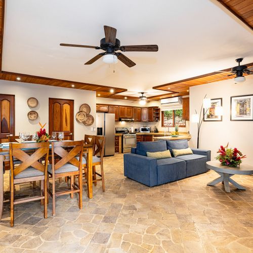 Living area with opent concept into kitchen, dining, and sitting area at Casa Blue Lagoon