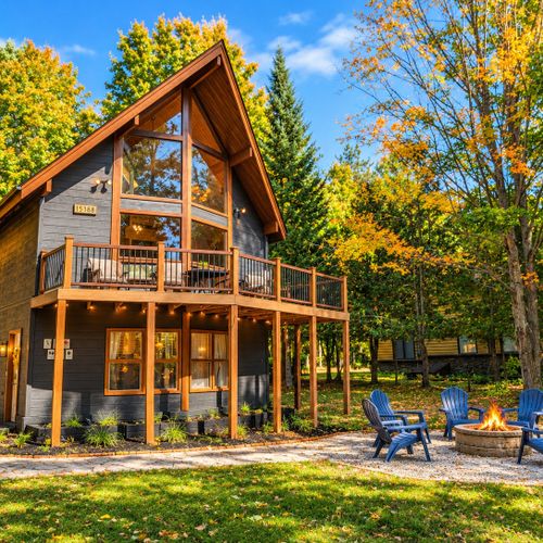 OVERVIEW:  The front of the chalet in the Fall, highlihting the front deck and the bonfire ring.