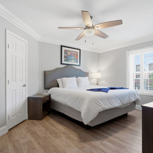 Cozy bedroom w/ a bed, warm tones & a Smart TV for winding down.
