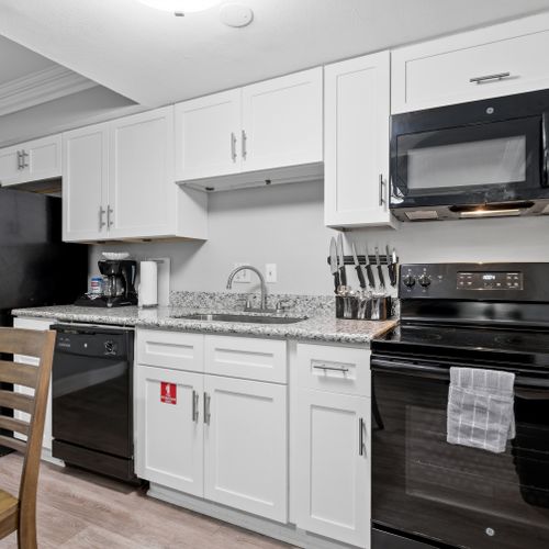 Unit 206 fully equipped kitchen & dining area for easy, relaxed meals.