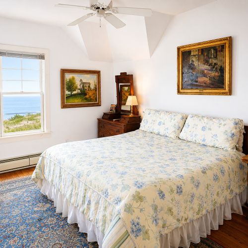BEDROOM #3 (SECOND FLOOR):  Another gorgeous second floor bedroom with a queen bed and incredible views of Lake Michigan and the Frankfort Lighthouse!