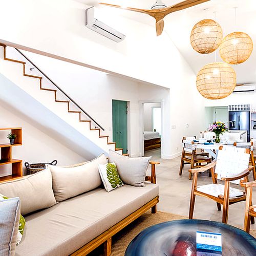Sink into the sofa downstairs, climb up to ocean views at night.