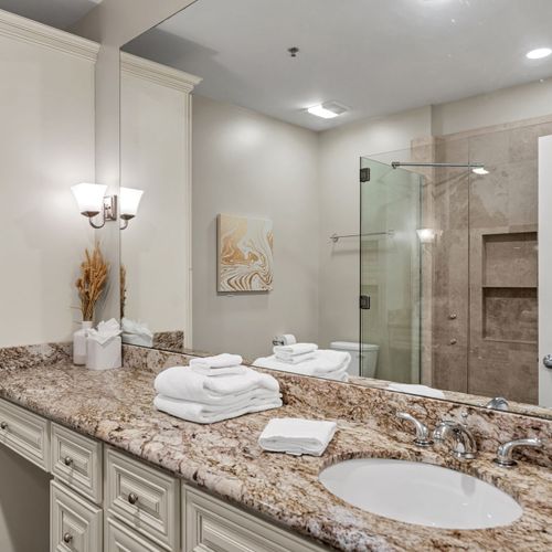 Glass shower and granite with spa vibes