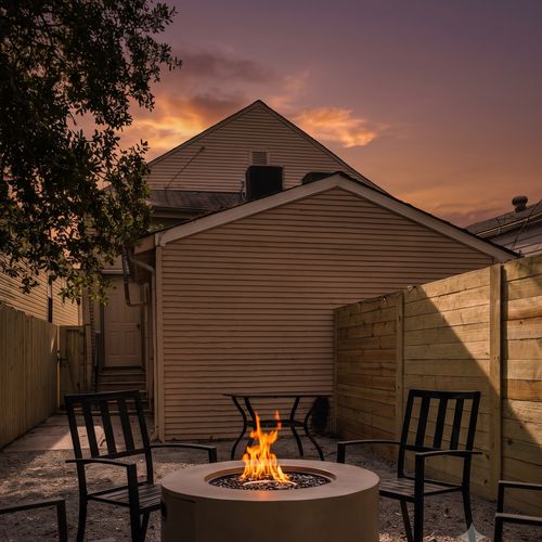 Private courtyard w/ a firepit & seating — ideal for unwinding after a long day.