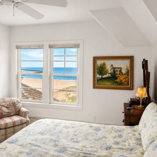 BEDROOM #3 (SECOND FLOOR):  Another gorgeous second floor bedroom with a queen bed and incredible views of Lake Michigan and the Frankfort Lighthouse!