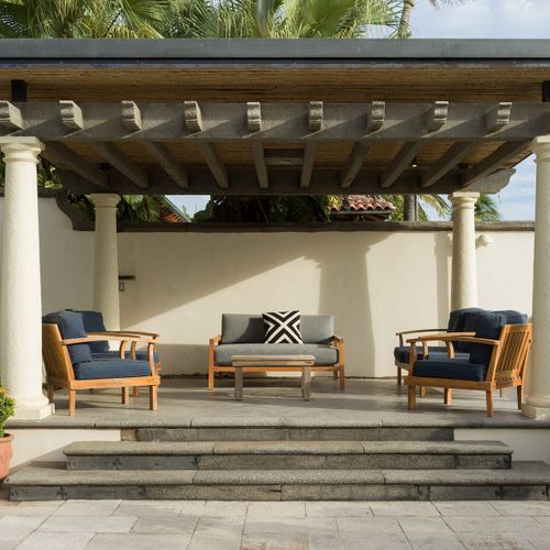 Great room from the chef island - iron mezzanine, spiral staircase, doors thrown open to the pool.