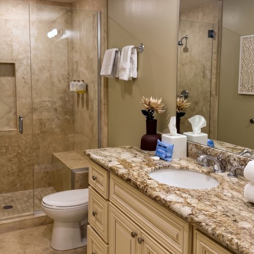 Spa-like bathroom with stone finishes