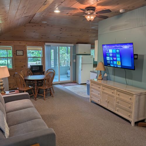 OVERVIEW: The interior view of the relaxing living room facing towards the cute dining table and the kitchen on the right