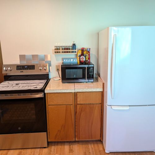 KITCHEN (MAIN FLOOR):  Modern kitchen with all appliances except for a dishwasher.