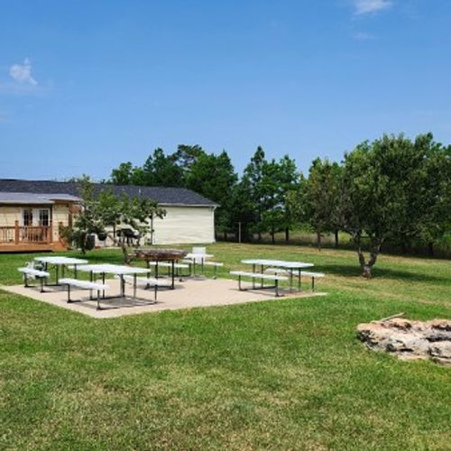 EXTERIOR:  The shared outdoor bonfire ring and picnic tables at the property.