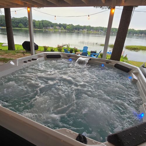 EXTERIOR:  The incredible new 6-person hot tub, with a great view of Bass Lake from the hot tub!