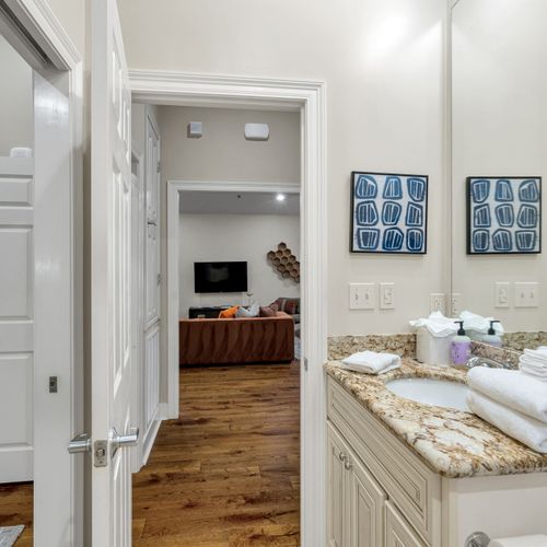 Bath vanity with a peek into the living room