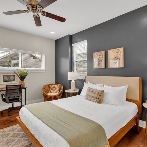 Cozy charcoal bedroom with a little desk nook