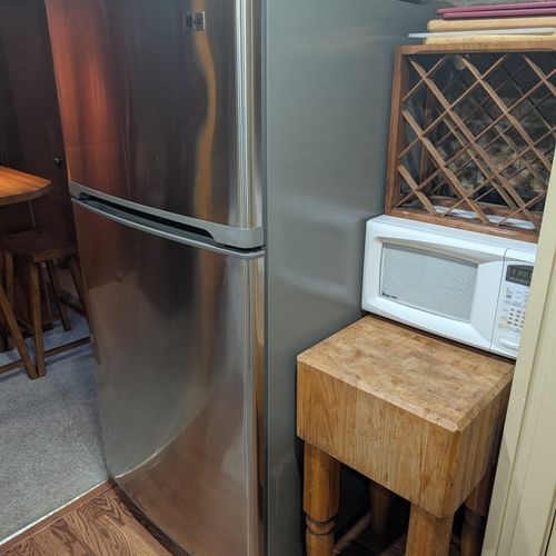KITCHEN (MAIN FLOOR):  The home has a full kitchen with all appliances including a dishwasher and a microwave.