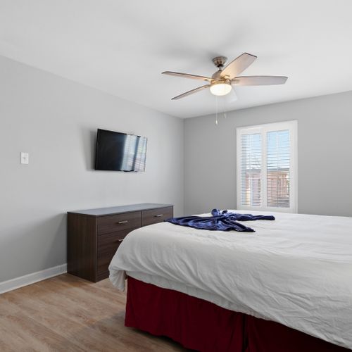 Secondary queen bedroom w/ a smart TV — comfortable & ready for guests.