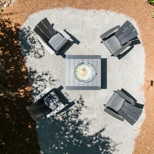 Gather around the fire pit under the trees for cozy evenings and starlit conversations.