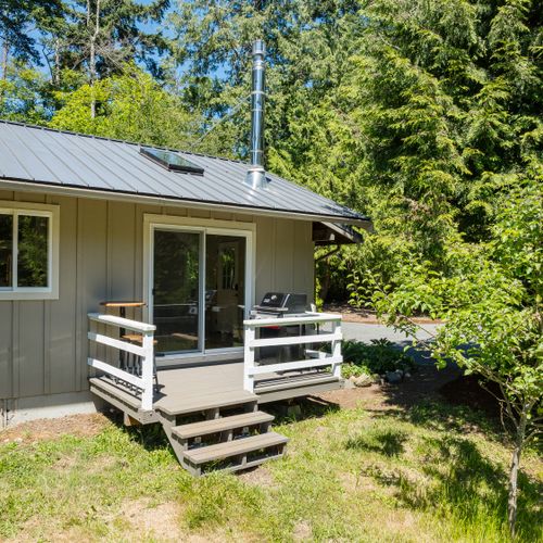 Enjoy outdoor dining and grilling on your private deck surrounded by nature.