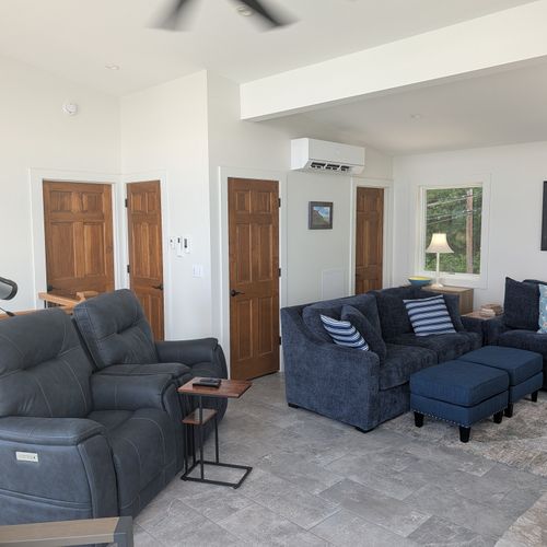 LIVING ROOM (THIRD FLOOR):  Large and luxurios top floor living room with incredible views of Crystal Lake!  (Note that the fireplace is not available for guest usage.)