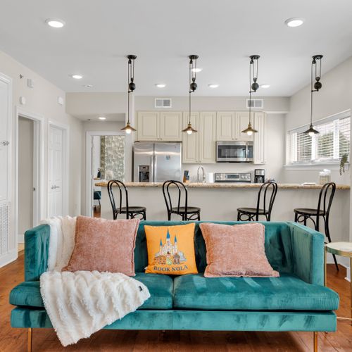 Pendant-lit kitchen overlooking the lounge