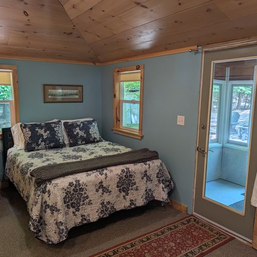 LIVING ROOM: The comfy, cozy queen bed adjoined to the living room