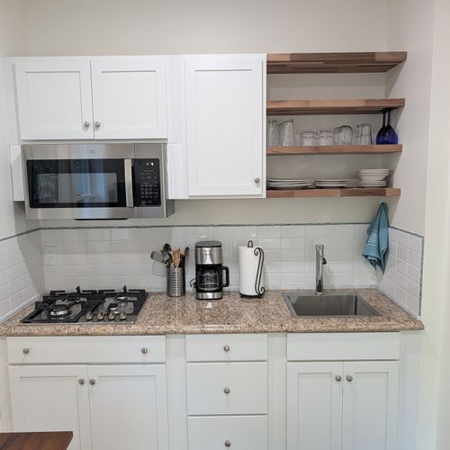 KITCHEN: The apartment's cute kitchen with a stove, microwave, coffeemaker, refridgerator, and other kitchen essentials. Perfect for cooking!