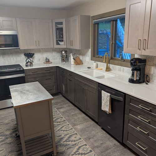KITCHEN (SECOND FLOOR):  Large modern kitchen with a portal island and all appliances including a dishwasher and microwave.