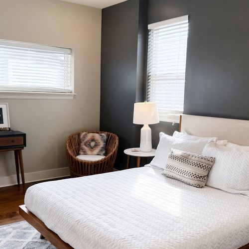 Bedroom w/ bed & natural light