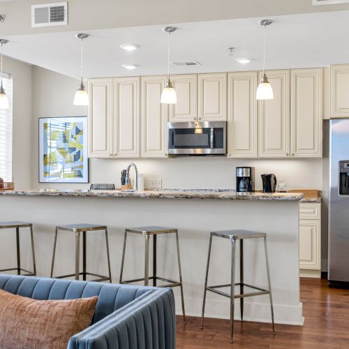 Breakfast bar seating under sleek pendant lights