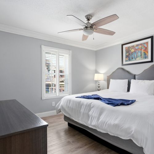 Unit 207 secondary king bedroom w/ calming tones & a bright, airy feel.