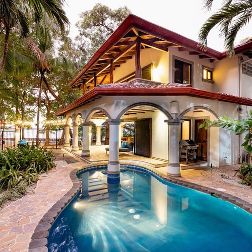 Casa Blue Lagoon at twilight - Mediterranean architecture, terracotta roof, private pool steps from the sand.