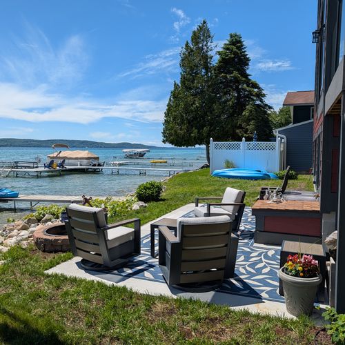EXTERIOR: The beautiful backyard with lake access to the pristine Crystal Lake. Plenty of seating, a firepit, and kayaks for guest use and enjoyment!