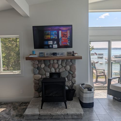 LIVING ROOM (THIRD FLOOR):  Large and luxurios top floor living room with incredible views of Crystal Lake!  (Note that the fireplace is not available for guest usage.)