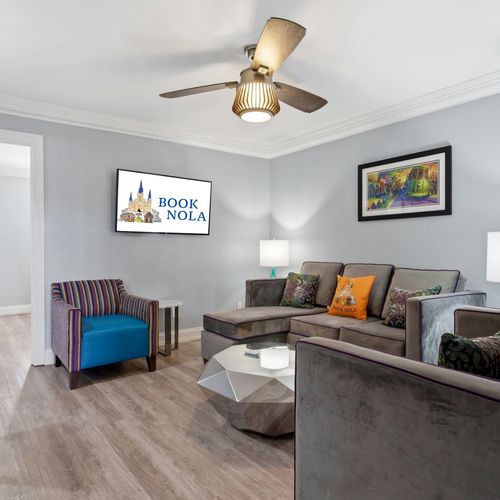Stylish living area w/ plush sofas & pops of color for laid-back lounging.