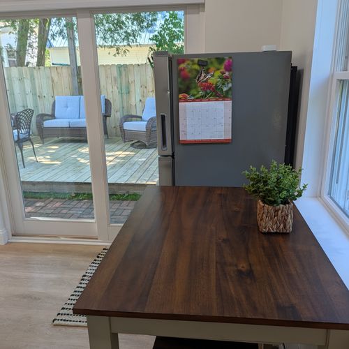 KITCHEN: The view from the accommodating kitchen and cute dining table out to the fantastic fenced-in backyard