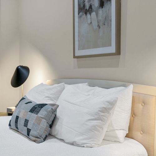 Soft pillows and a sleek reading light