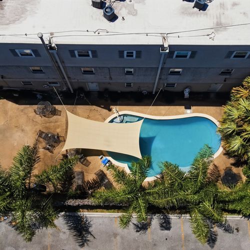 Bird's-eye view of the property nestled in a lively neighborhood.