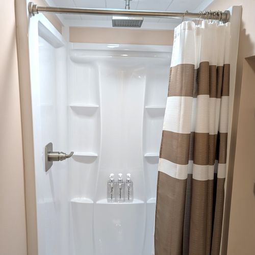BATHROOM #2 (LOWER LEVEL):  Full bathroom on the lower level.  Just like the main floor bathroom, it features a relaxing rain shower!