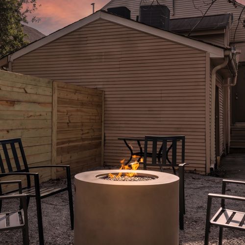 Cozy courtyard firepit made for lingering conversations under the evening sky.