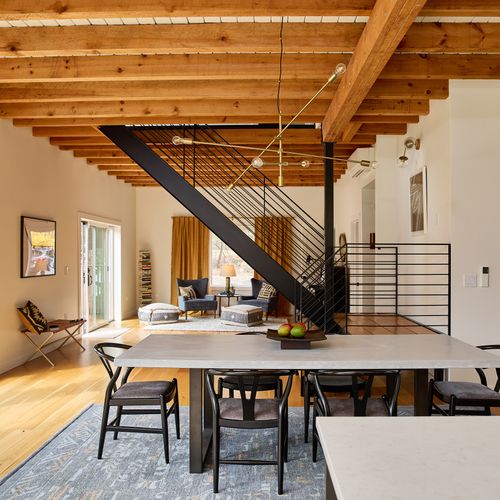 The main house dining area and central stairs, looking towards the music room.