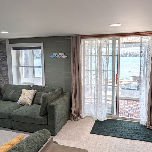 RECREATION ROOM (LOWER LEVEL):  The home has a very cute and fun recreation room in the lower level that is complete with a wet bar and mini-frig.
