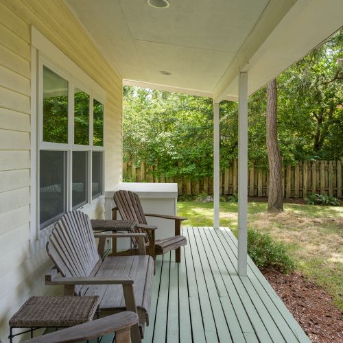 Take a seat on the covered porch and enjoy the sights and sounds of the spacious yard, where nature and tranquility are always just steps away.